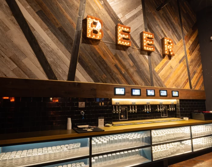 A bar with beer on the wall.