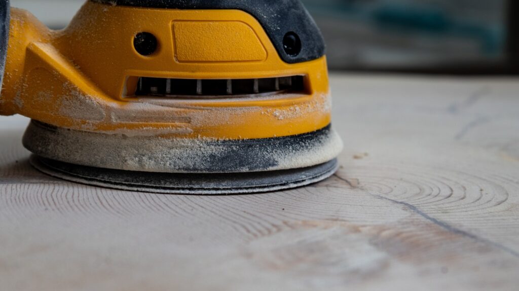 Black and yellow floor sander