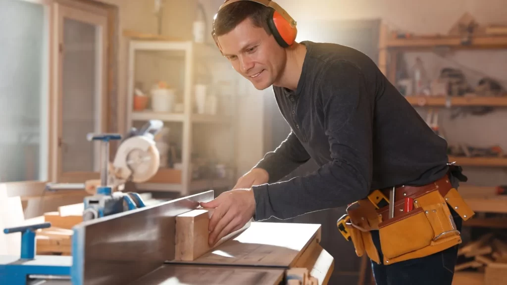 a man cutting wood