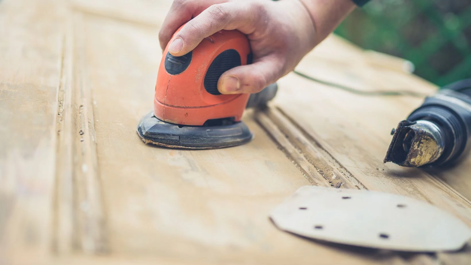 sanding a wooden door